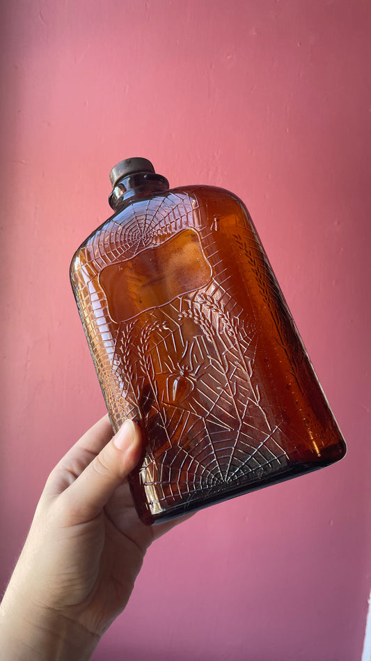 Antique Amber Spiderweb Whiskey Bottle | Four Roses
