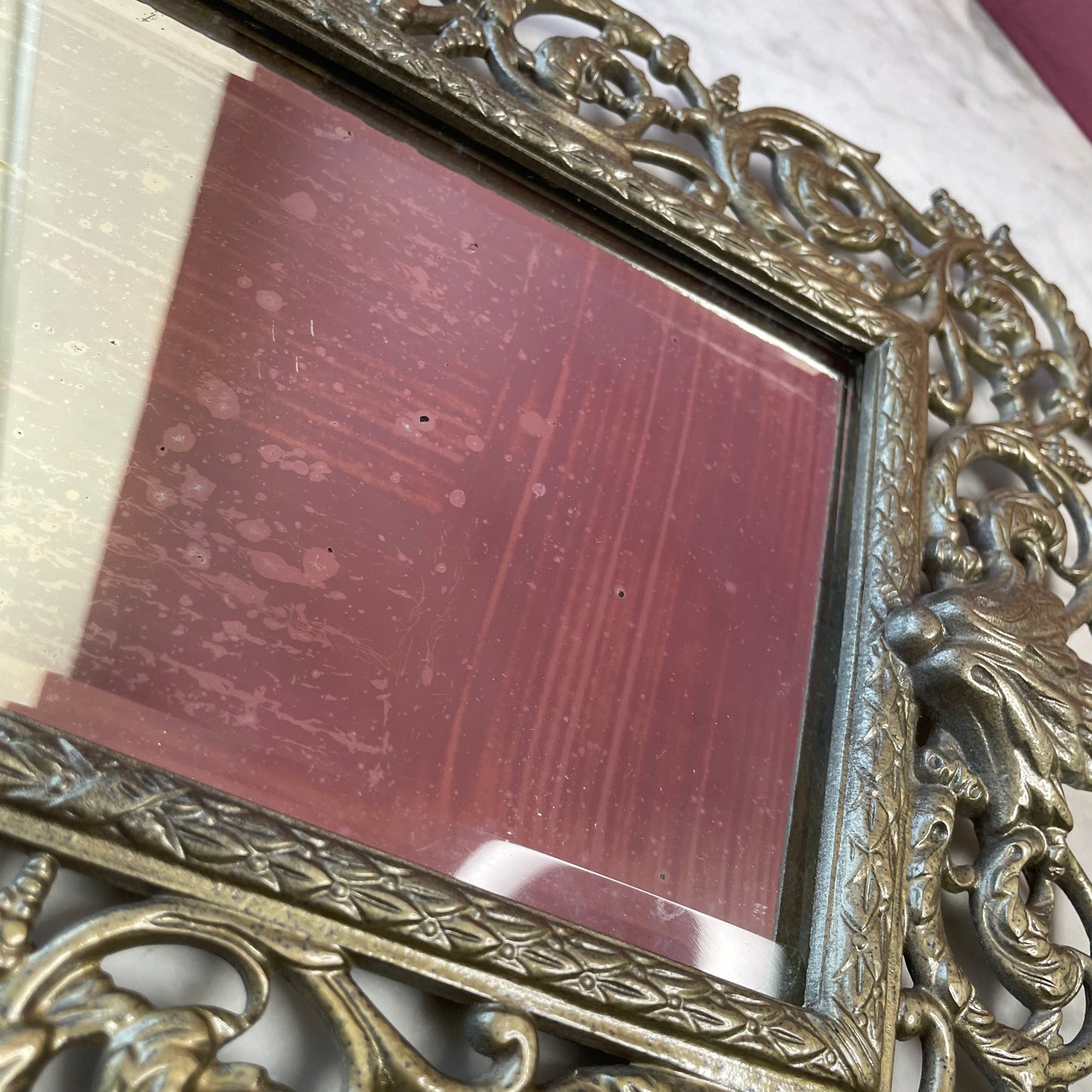 RESERVED Antique Bacchus Mirror