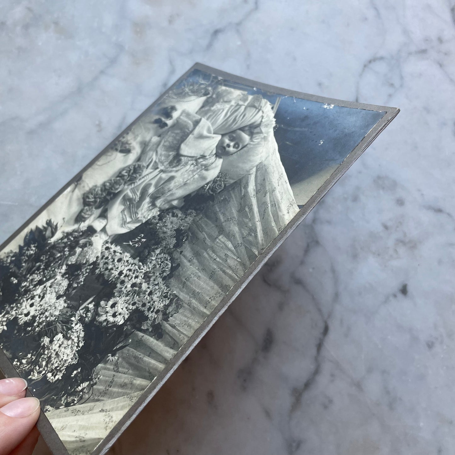 Post Mortem Photo of Baby Surrounded by Flowers
