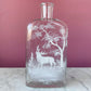 Antique Whiskey Bottle with White Enameled Deer