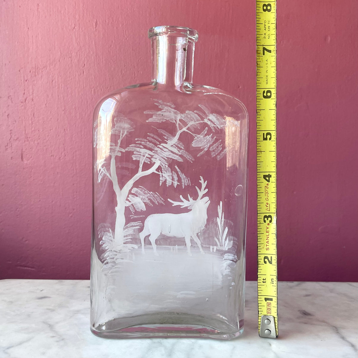 Antique Whiskey Bottle with White Enameled Deer