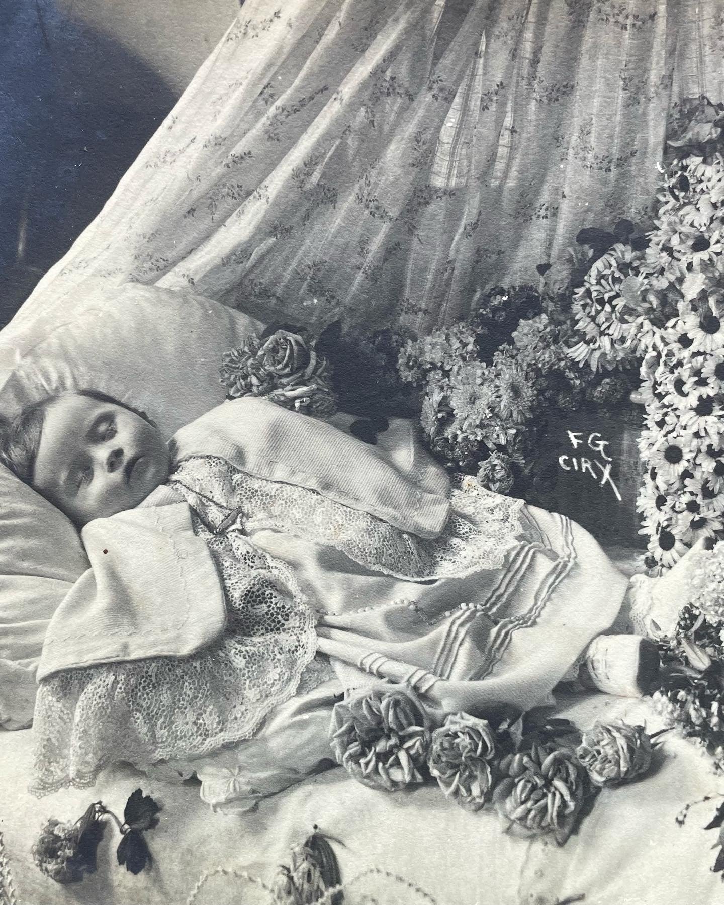 Post Mortem Photo of Baby Surrounded by Flowers